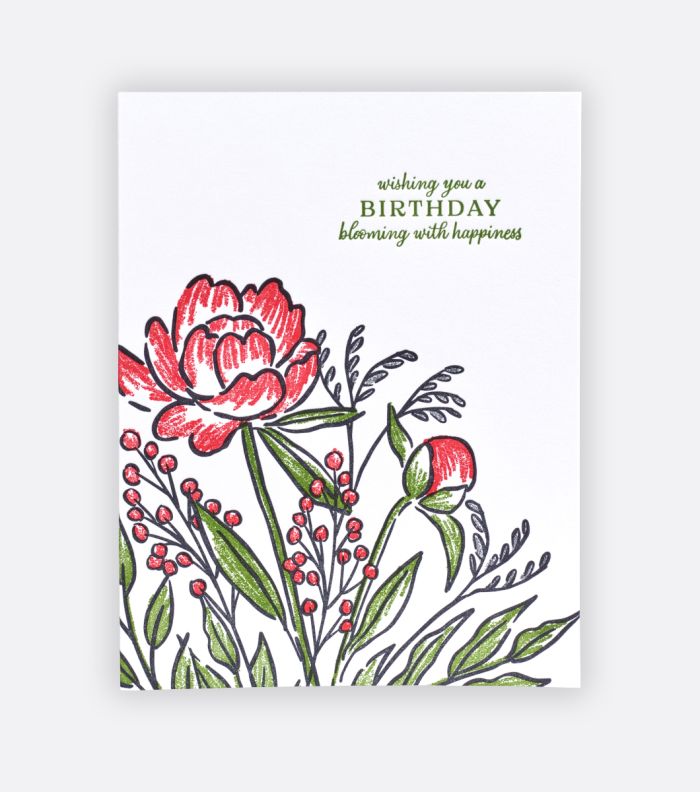 sketchbook bouquet letterpress greeting card on a light gray background with sketchily drawn flowers and greenery with a message that says "wishing you a birthday blooming with happiness"