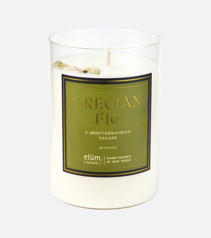 grecian fig scented candle with green label on grey background 